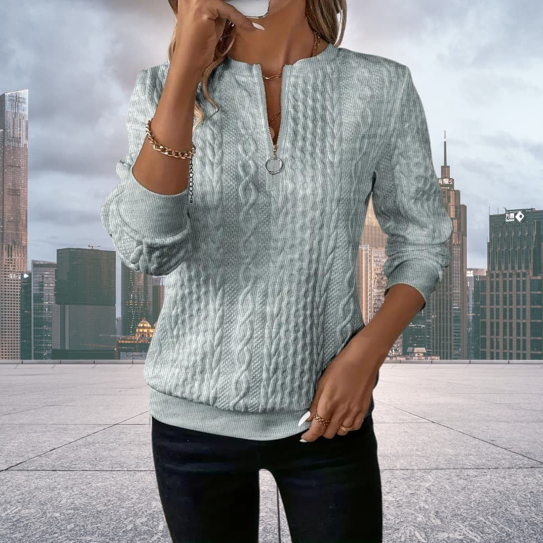Woman wearing the Daisy women's elegant sweater, side view