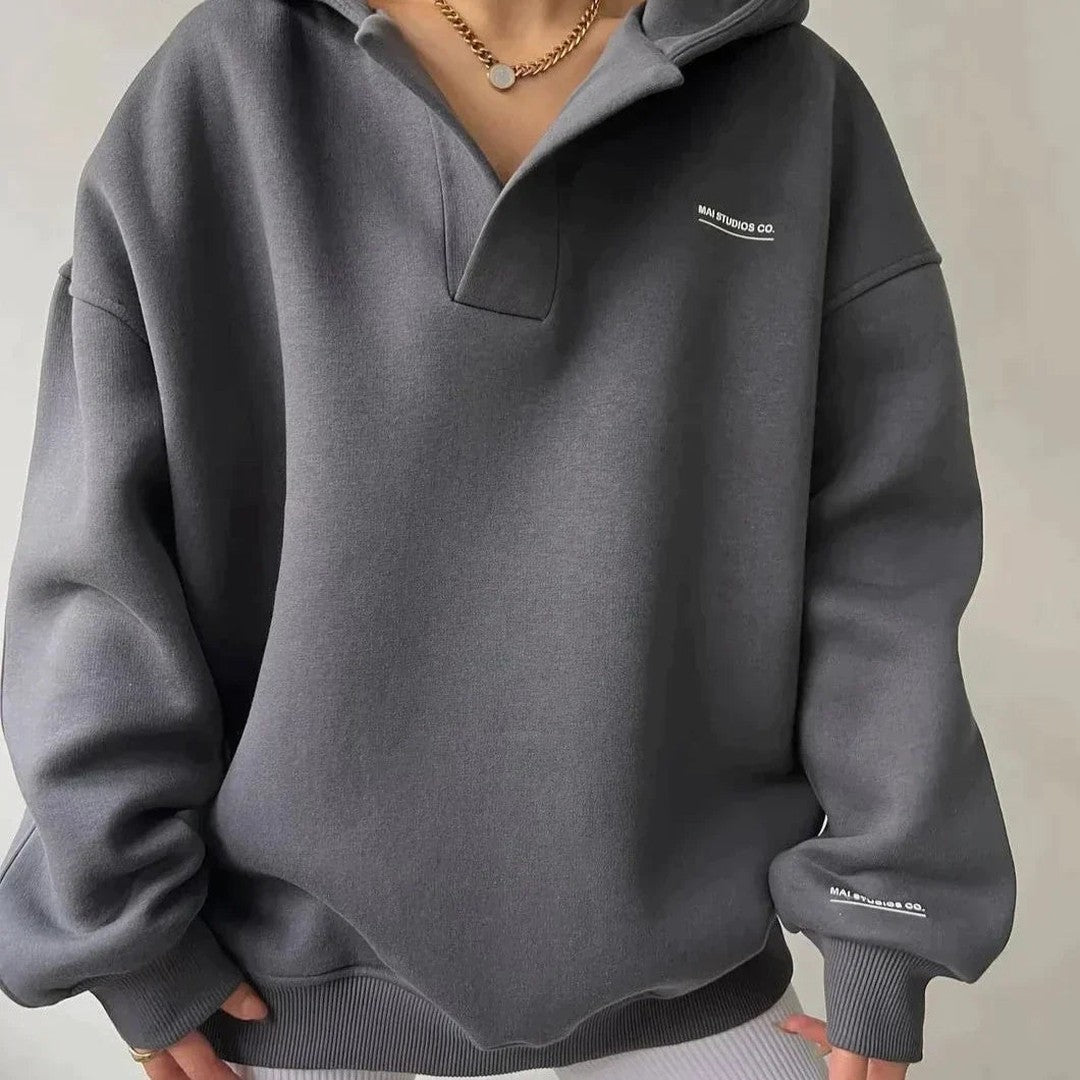 Woman wearing the Delphine women's sweater, back view