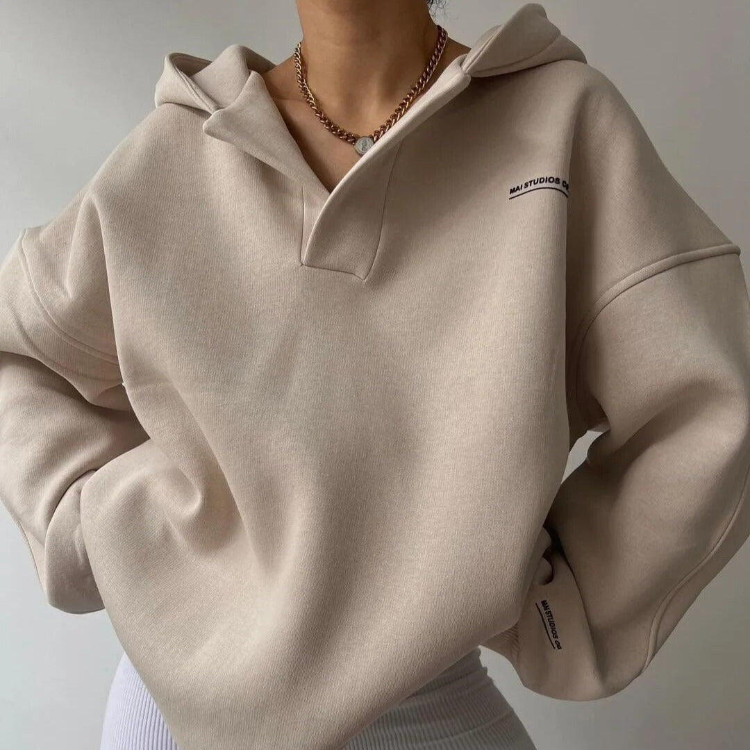 Woman wearing the Delphine women's sweater, flatlay view