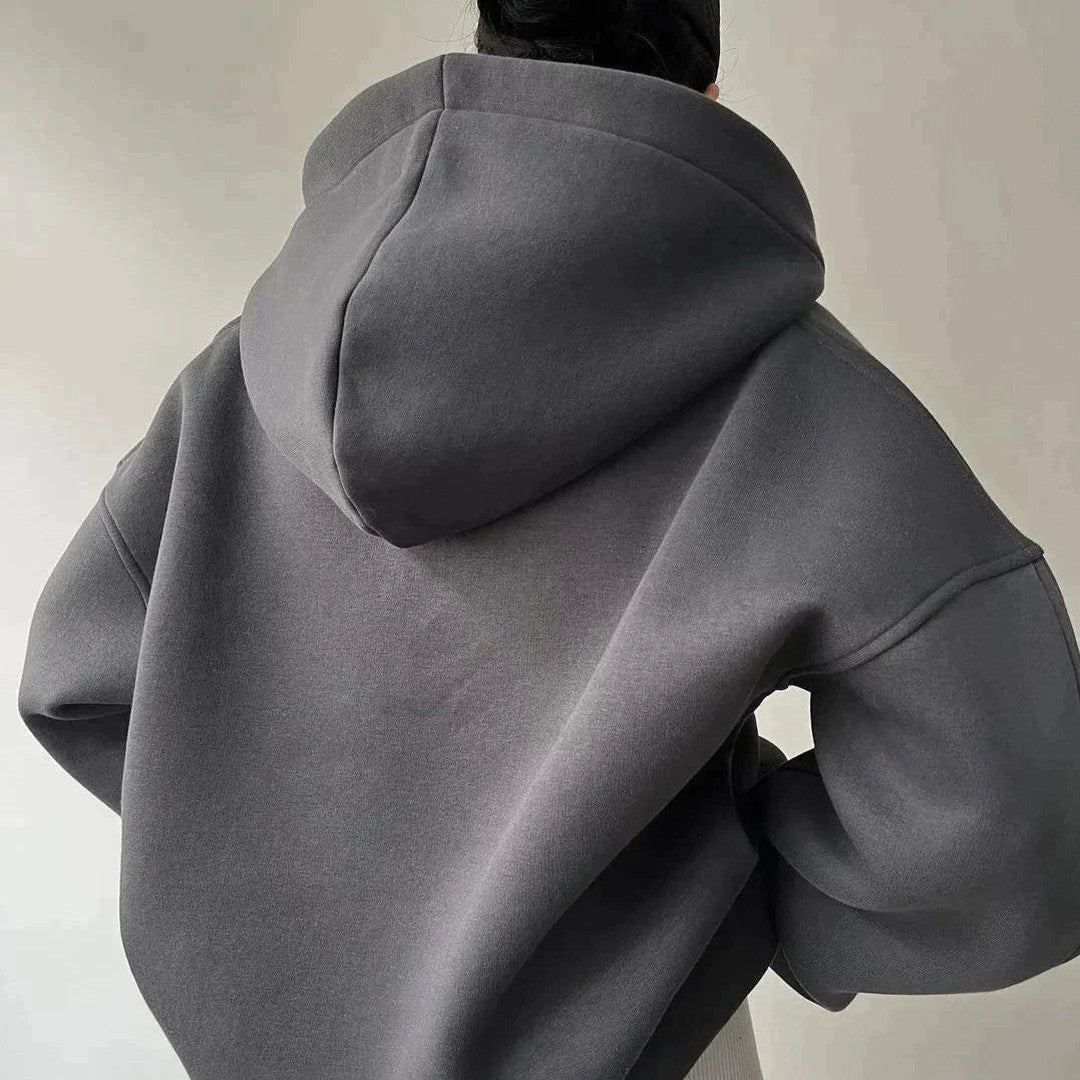 Woman wearing the Delphine women's sweater, side view