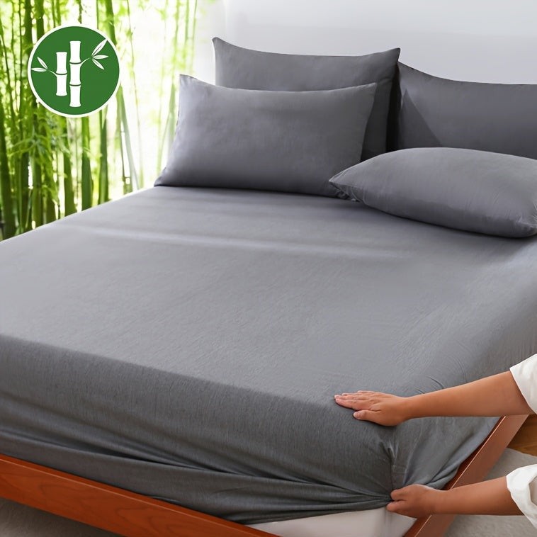 Bamboo blend fitted sheet in a made bed - product photo 1