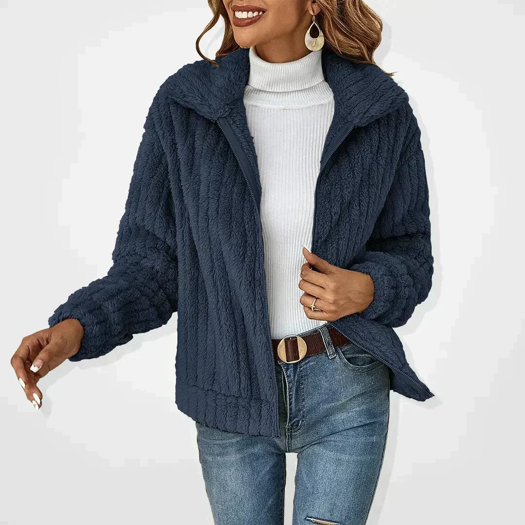 Woman wearing the Eira women's knit cardigan, back view