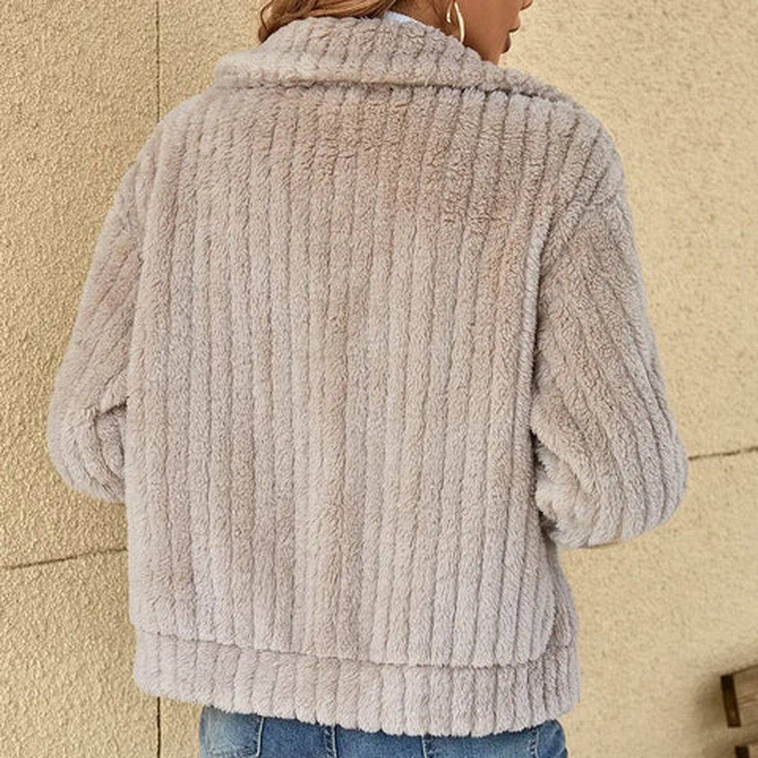 Woman wearing the Eira women's knit cardigan, flatlay view