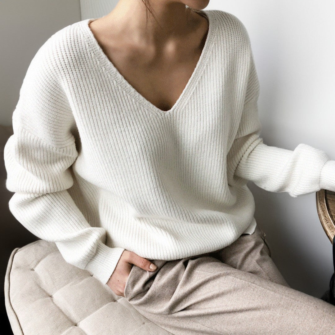 Woman wearing the Elise women's v-neck knit sweater, back view