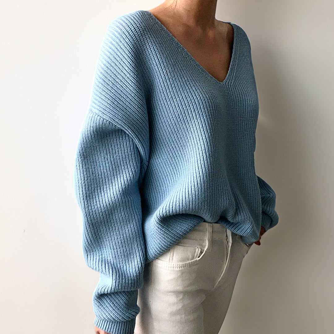 Woman wearing the Elise women's v-neck knit sweater, front view