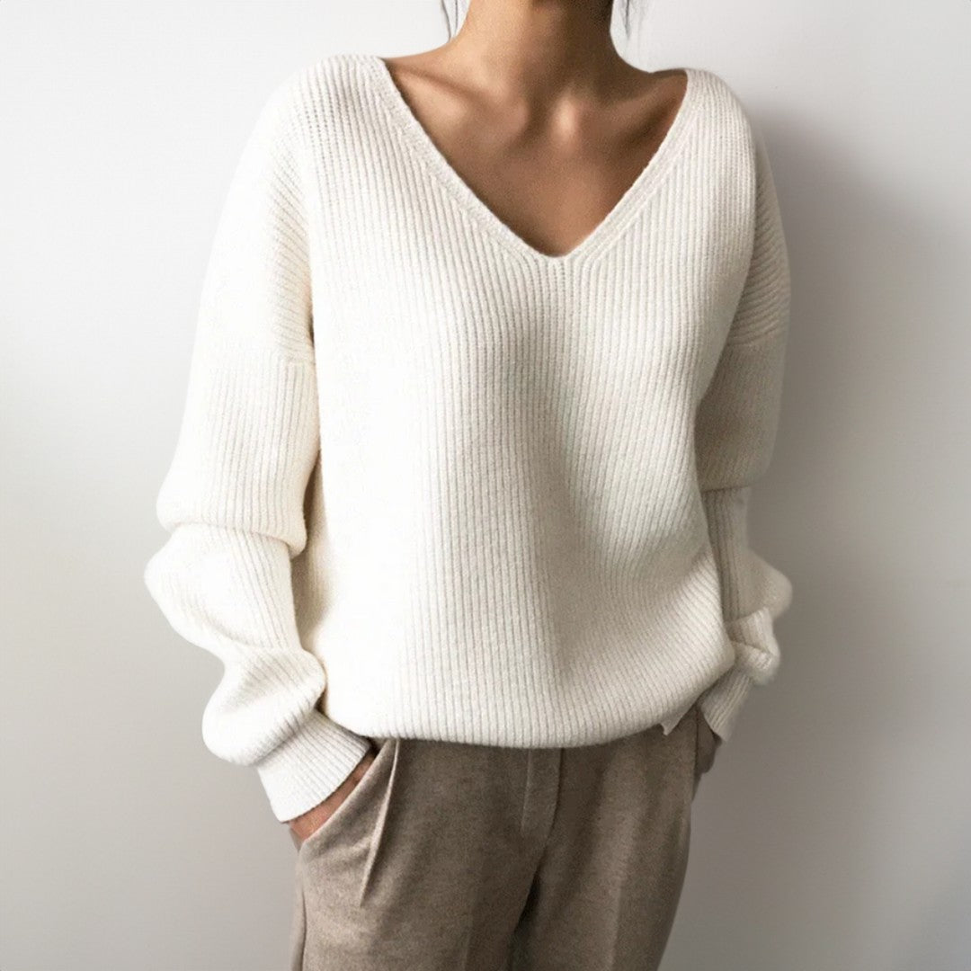 Woman wearing the Elise women's v-neck knit sweater, model view