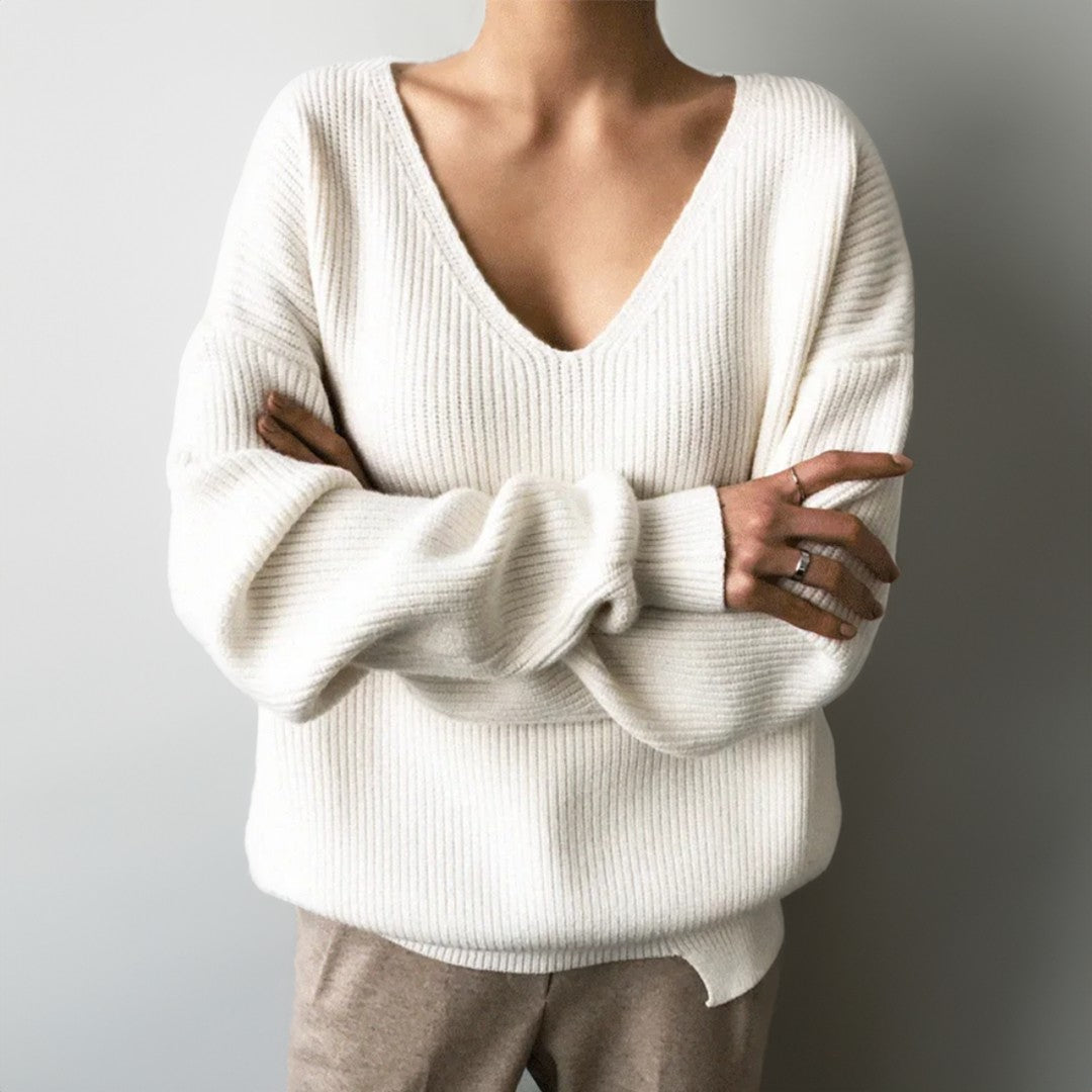 Woman wearing the Elise women's v-neck knit sweater, side view