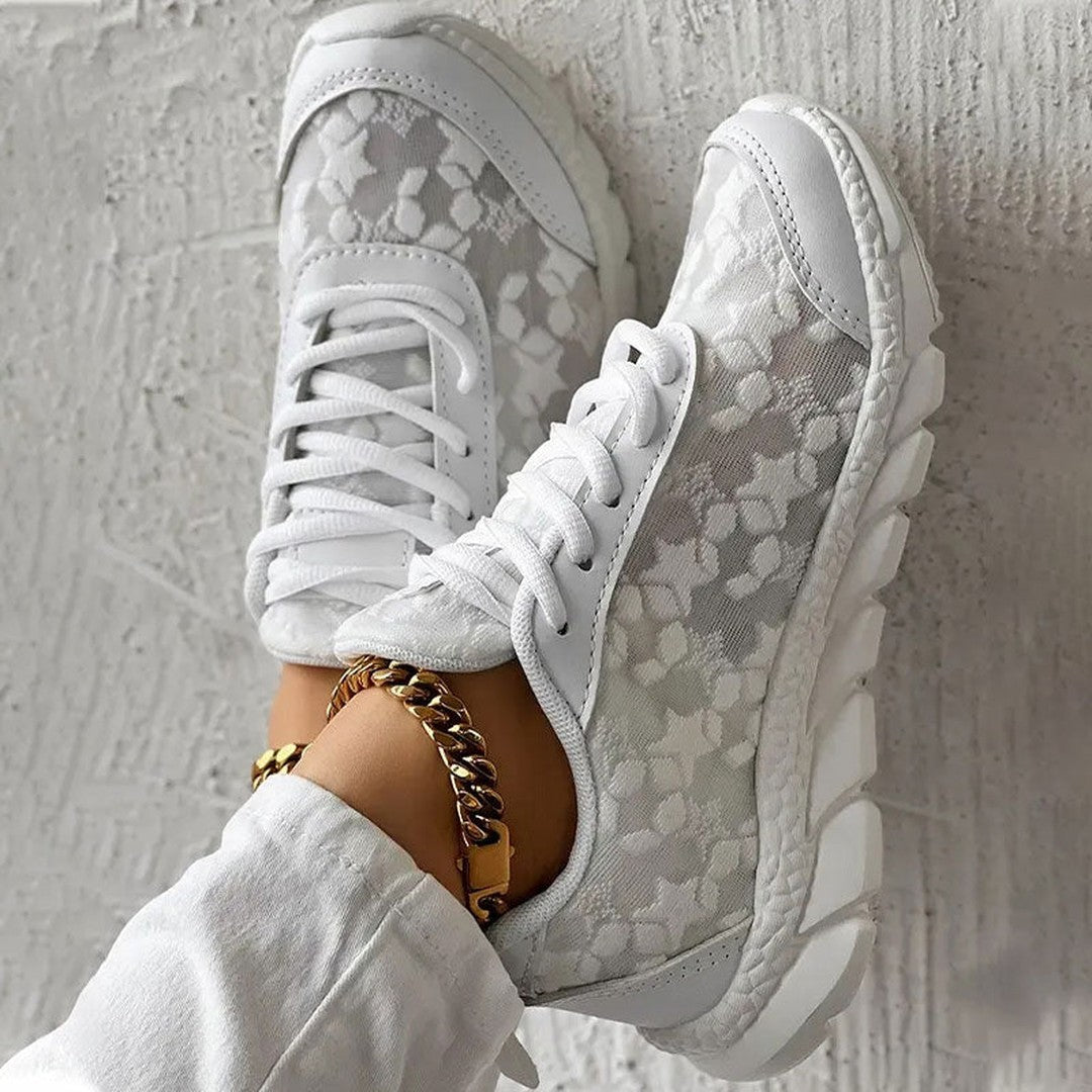 Woman wearing the Elodie women's sneakers, side view