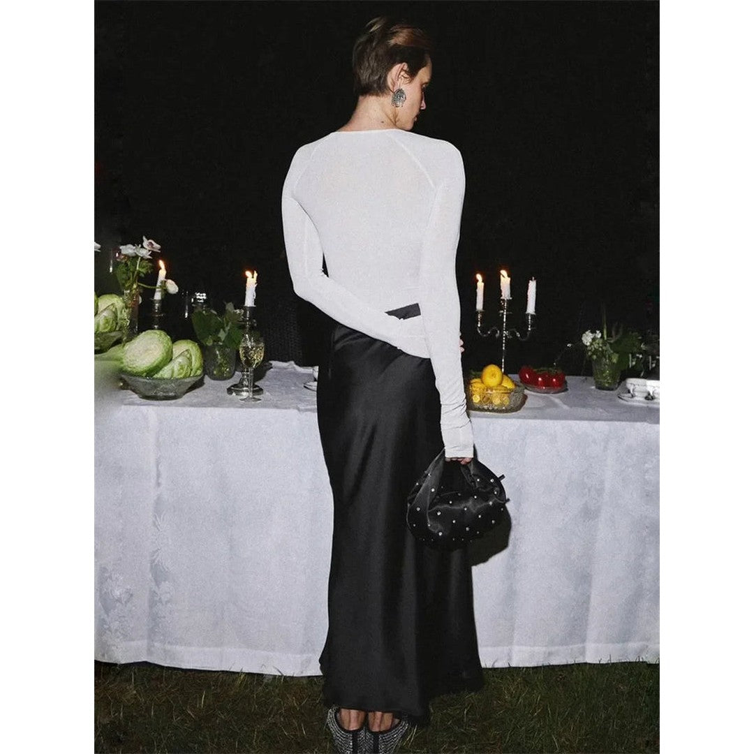 Woman wearing the Eloise women's maxi satin elegant skirt, back view