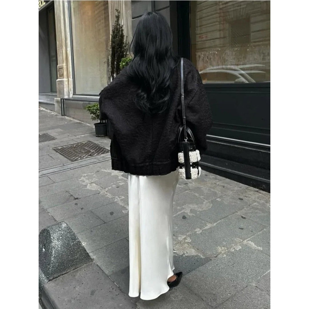 Woman wearing the Eloise women's maxi satin elegant skirt, detail view