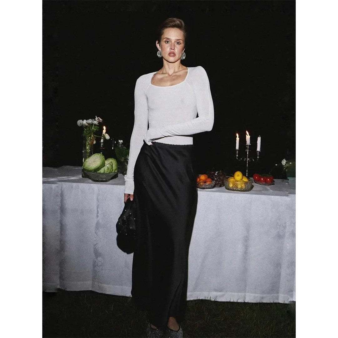 Woman wearing the Eloise women's maxi satin elegant skirt, front view