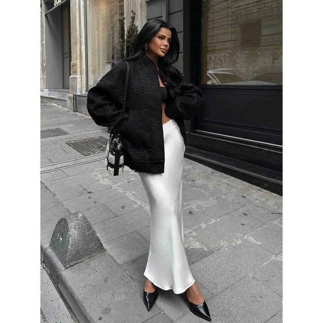 Woman wearing the Eloise women's maxi satin elegant skirt, side view