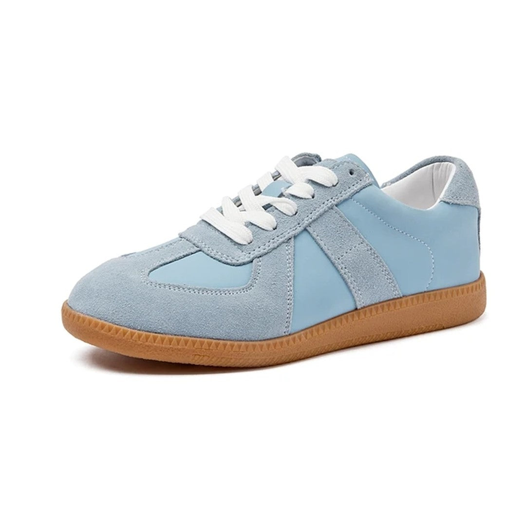 Woman wearing the Ember women's leather shoes, model view