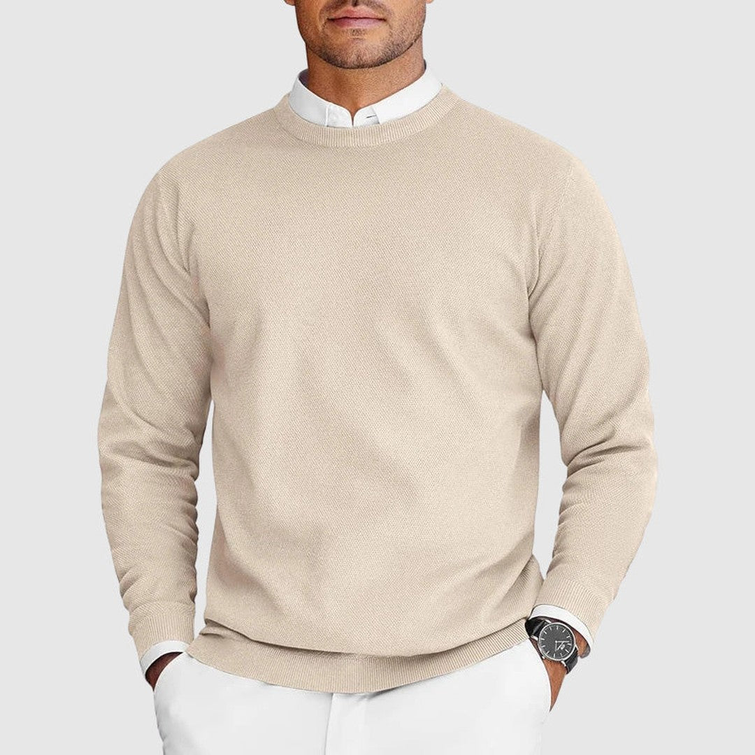 Man wearing the Ezra men's crewneck sweater, side view