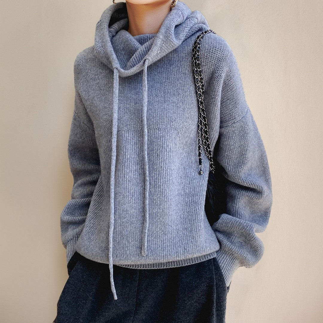 Woman wearing the Farrah women's oversized mock-neck knit sweater, back view