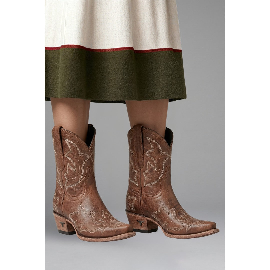 Woman wearing the Fenella women's embroidered boots, flatlay view