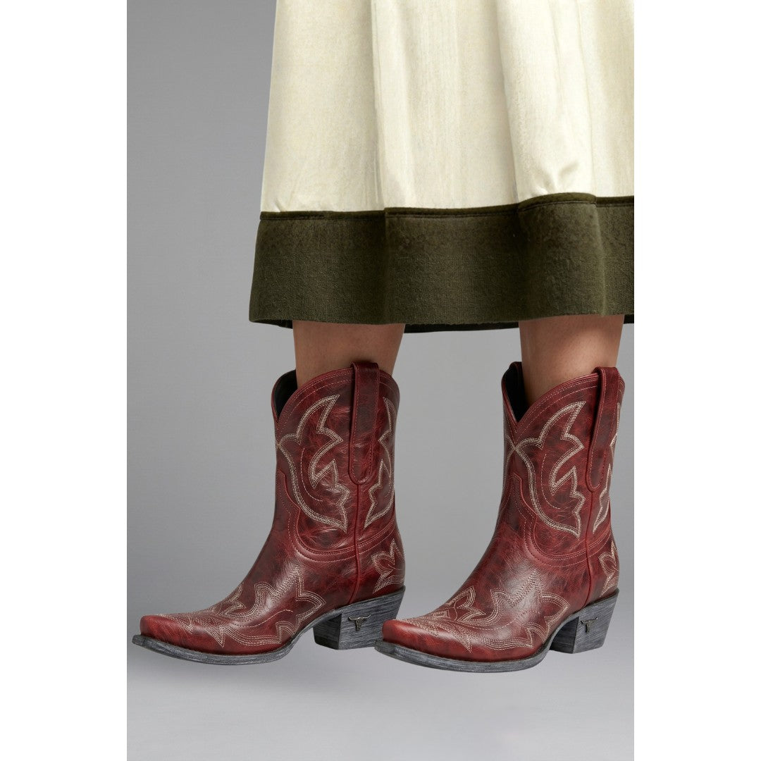 Woman wearing the Fenella women's embroidered boots, model view