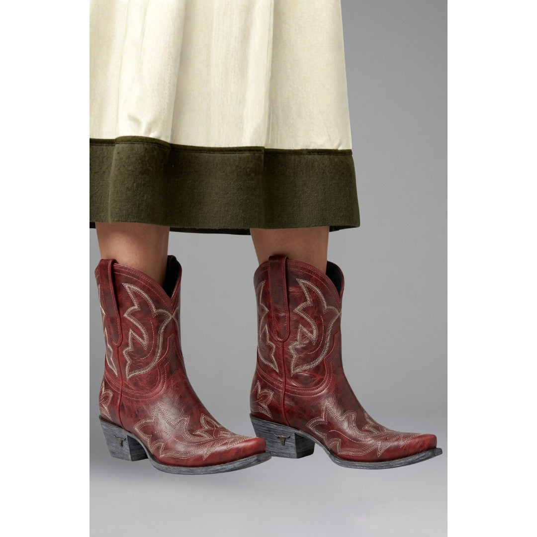 Woman wearing the Fenella women's embroidered boots, side view