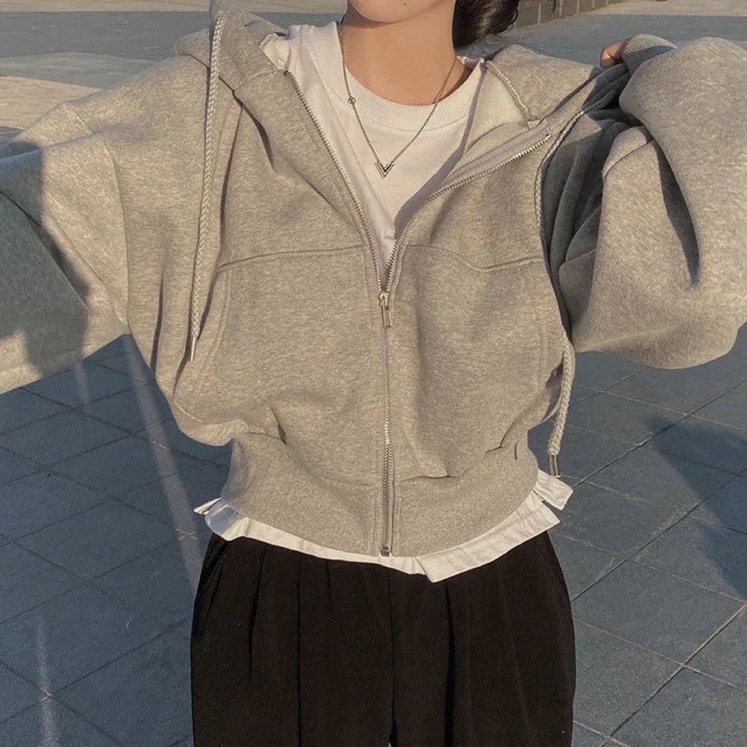 Woman wearing the Fiona women's zip-up sweatshirt, detail view