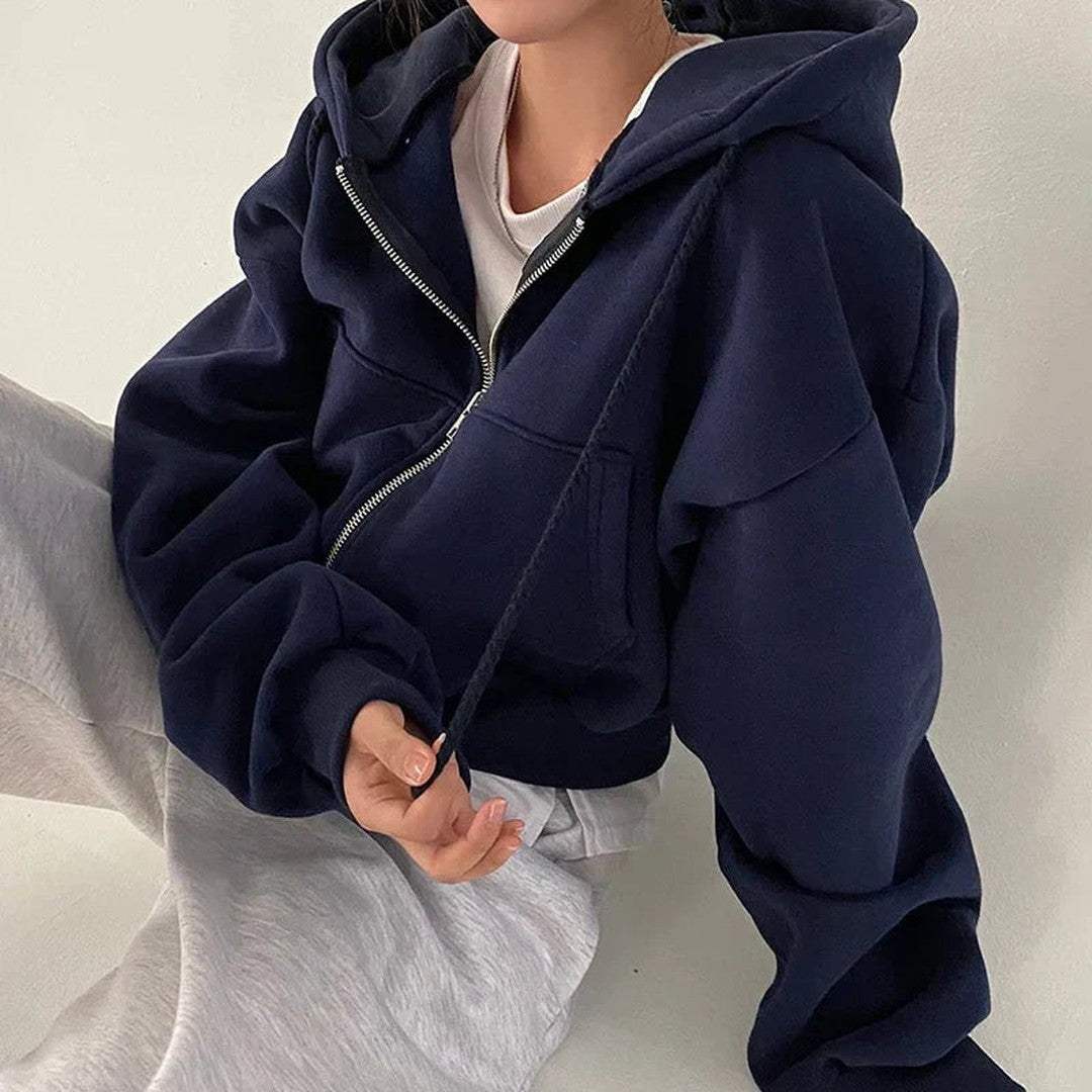 Woman wearing the Fiona women's zip-up sweatshirt, front view