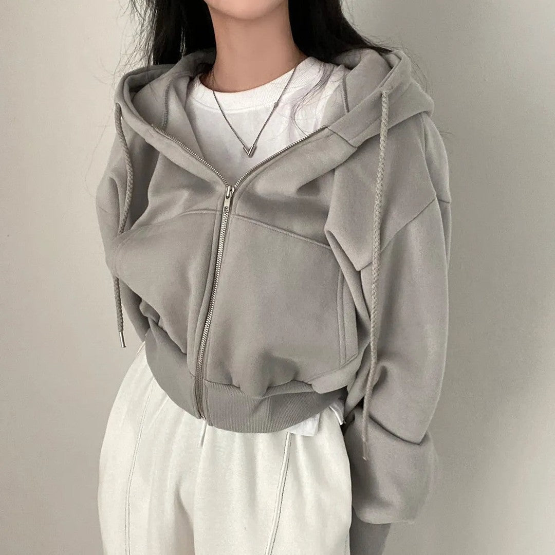 Woman wearing the Fiona women's zip-up sweatshirt, model view