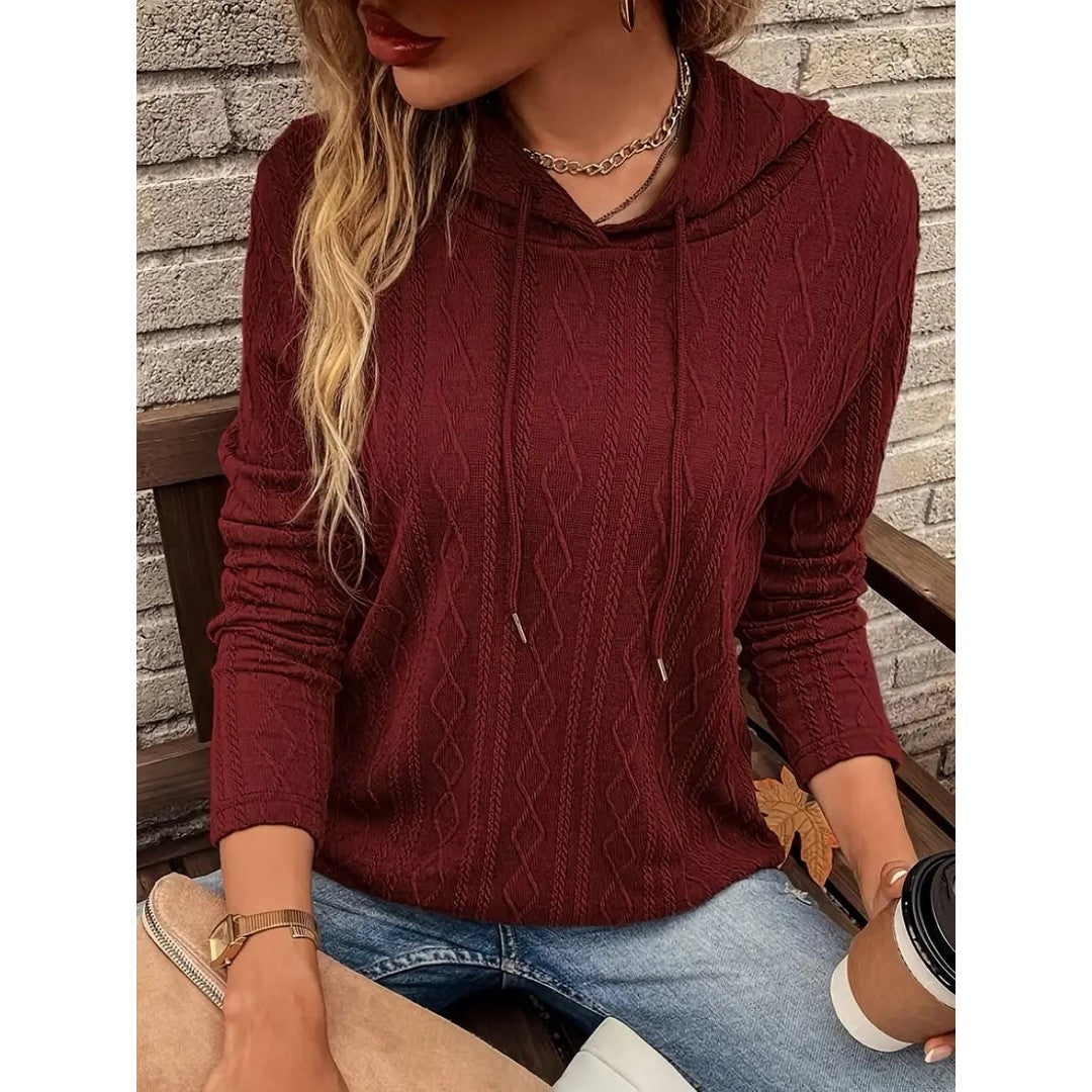 Woman wearing the Flora women's hooded hoodie, front view