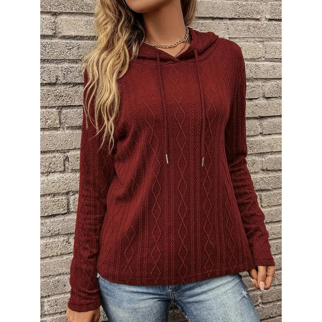 Woman wearing the Flora women's hooded hoodie, side view
