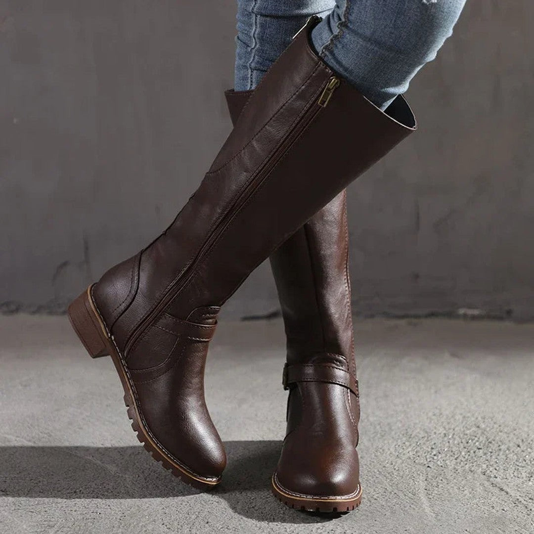 Woman wearing the Frankie women's leather elegant boots, side view