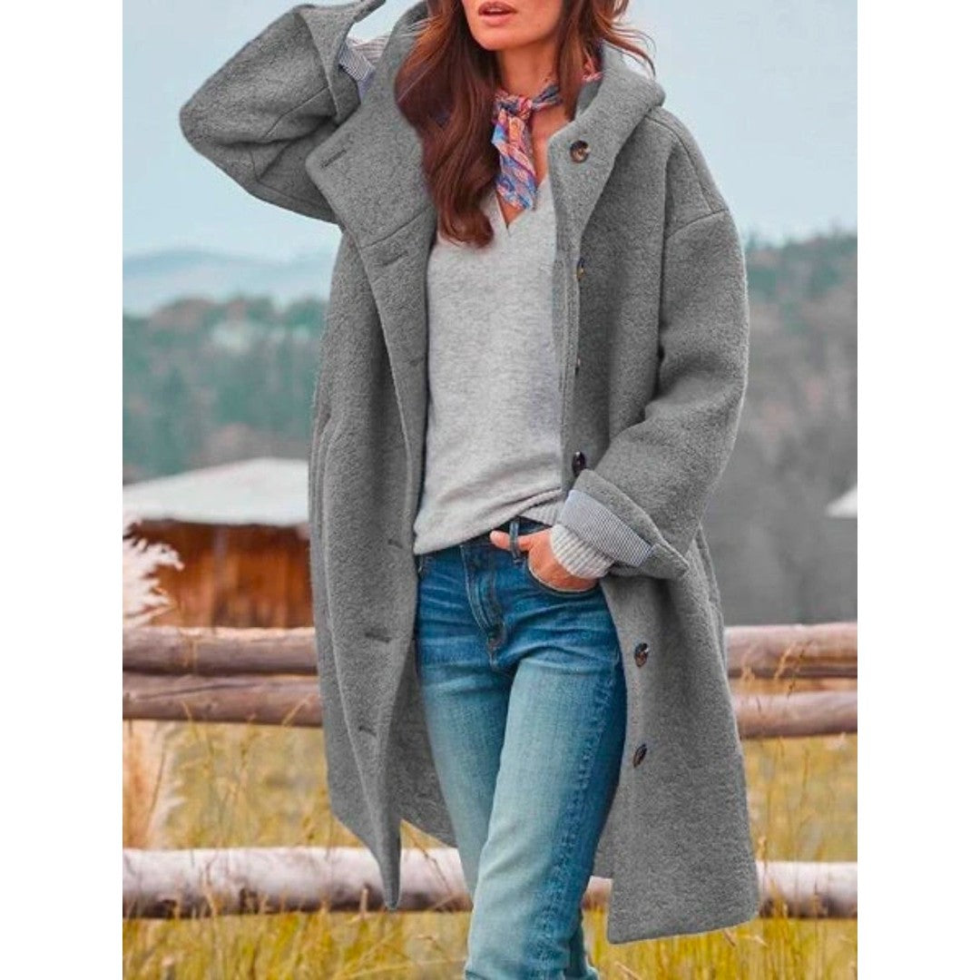 Woman wearing the Freya women's hooded coat, back view