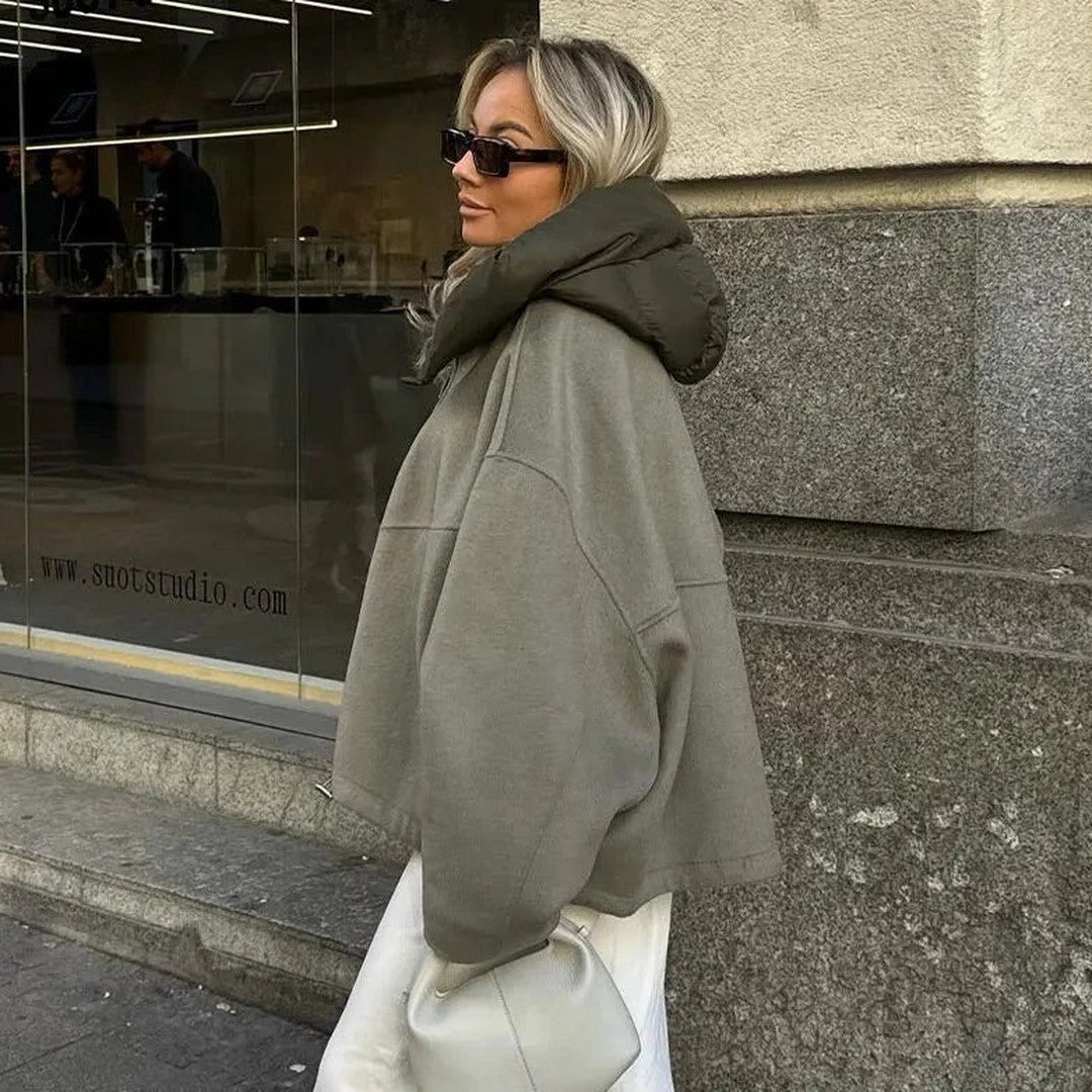 Woman wearing the Gaia women's relaxed hooded jacket, front view