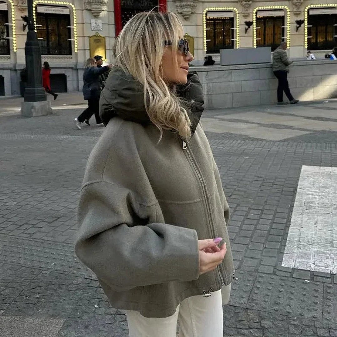 Woman wearing the Gaia women's relaxed hooded jacket, side view