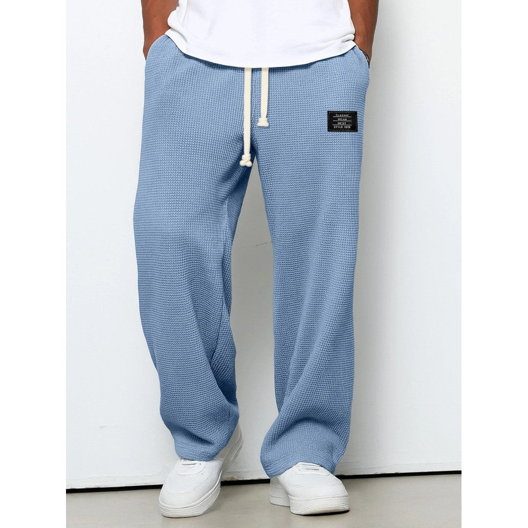 Man wearing the Gerard men's relaxed denim breathable pants, front view