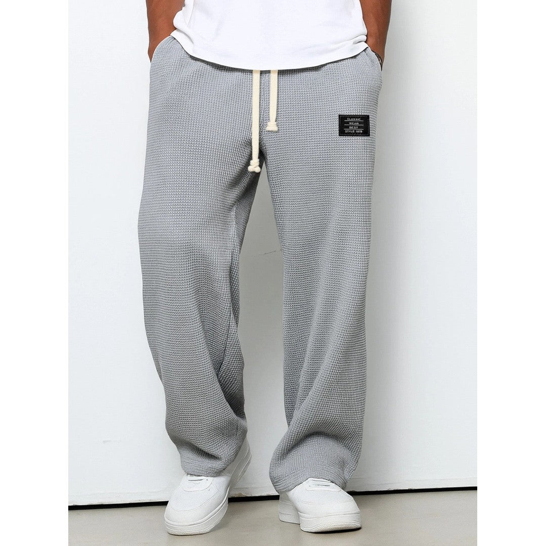 Man wearing the Gerard men's relaxed denim breathable pants, side view