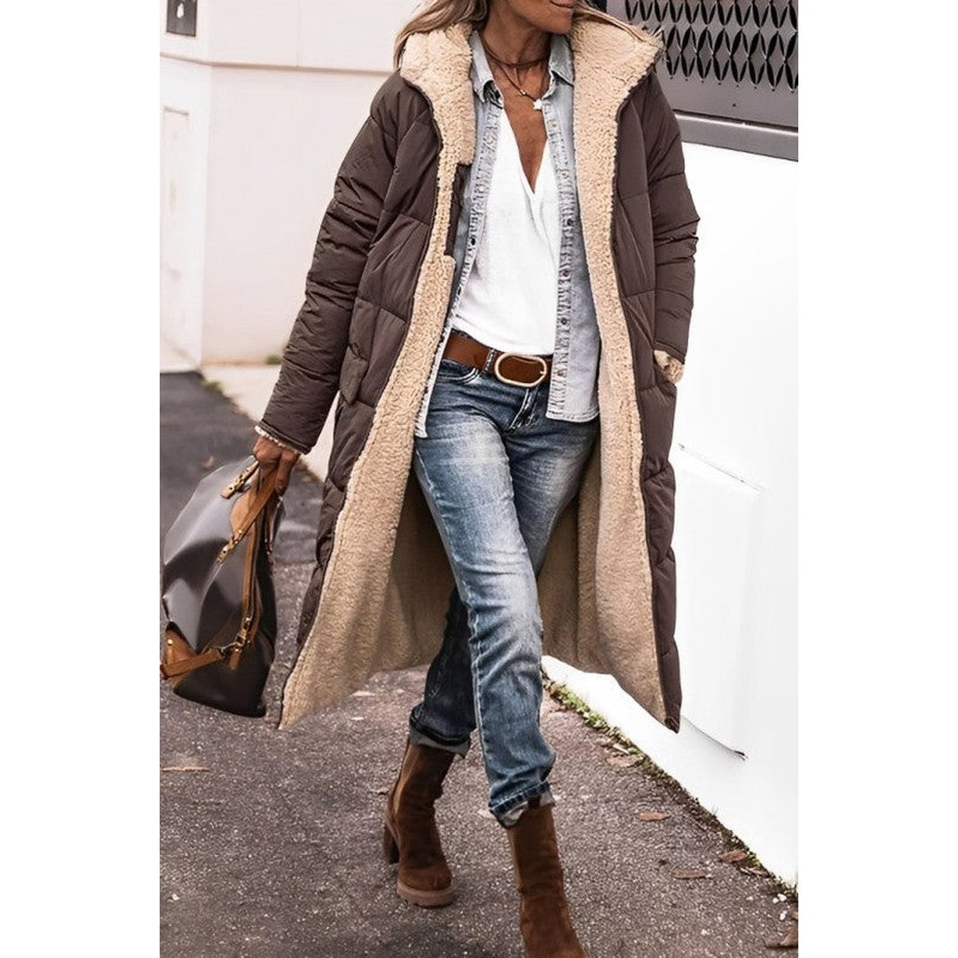 Woman wearing the Katarina women's long-sleeve coat, front view