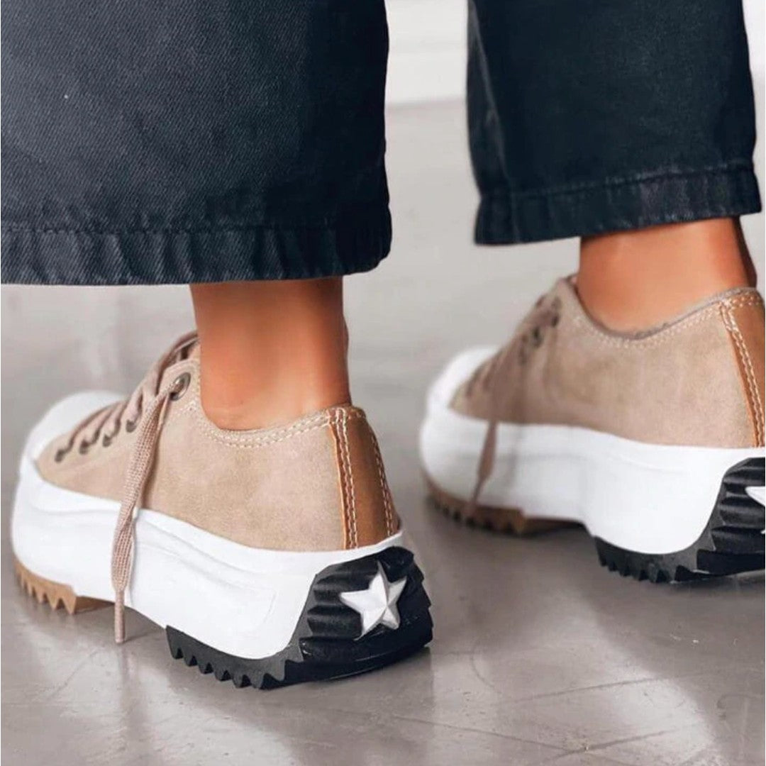 Woman wearing the Mila women's sneakers, front view