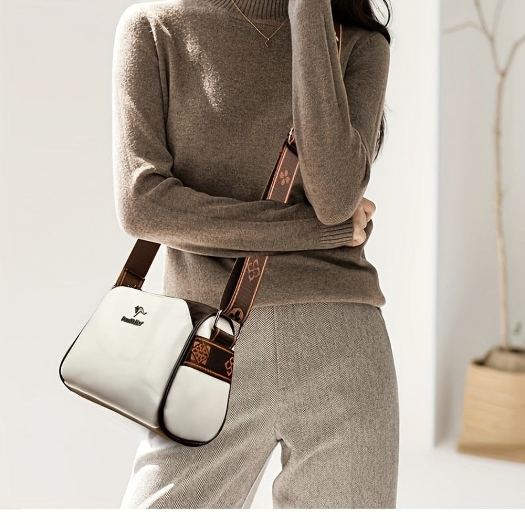 Woman wearing the Mira women's leather pocket detail bag, detail view