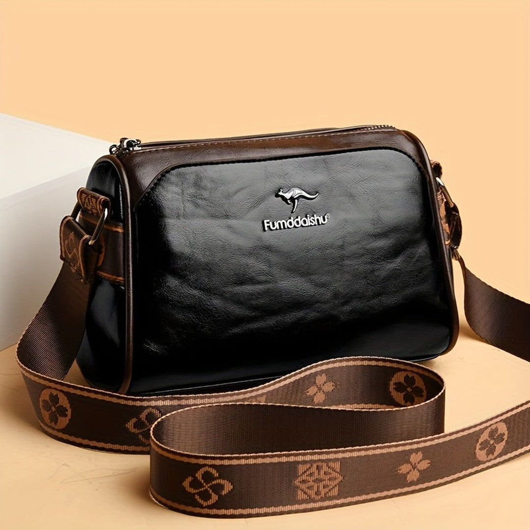 Woman wearing the Mira women's leather pocket detail bag, front view