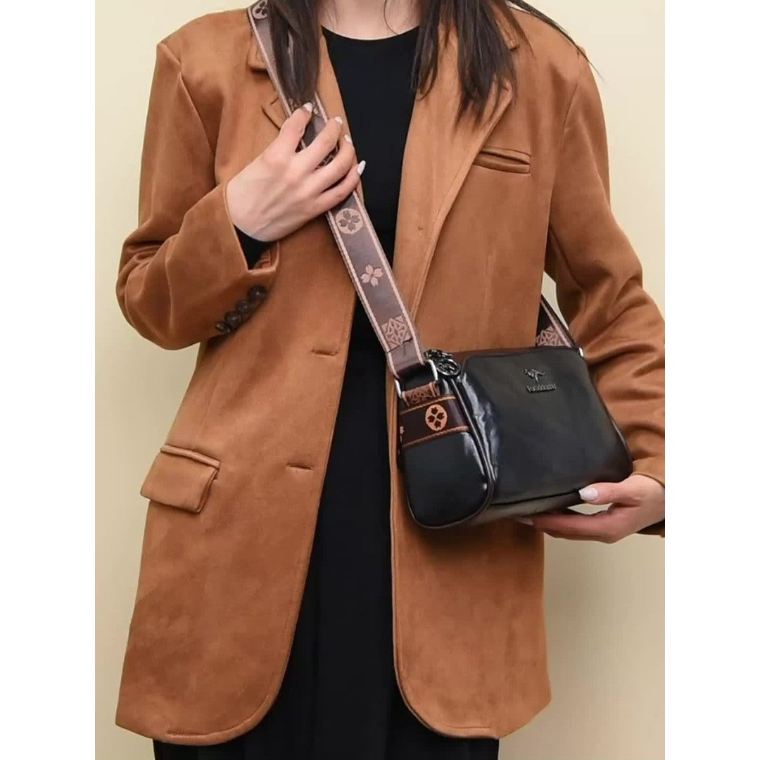 Woman wearing the Mira women's leather pocket detail bag, side view