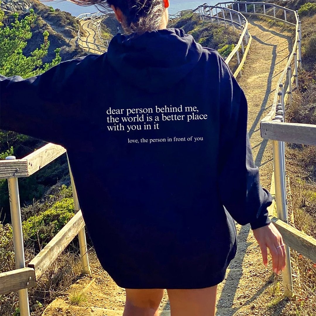 Woman wearing the Naomi women's hoodie, back view