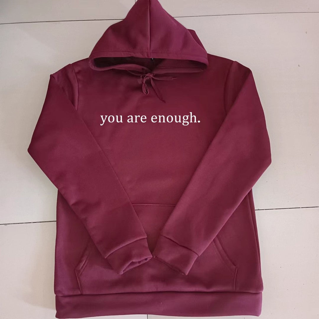 Woman wearing the Naomi women's hoodie, side view
