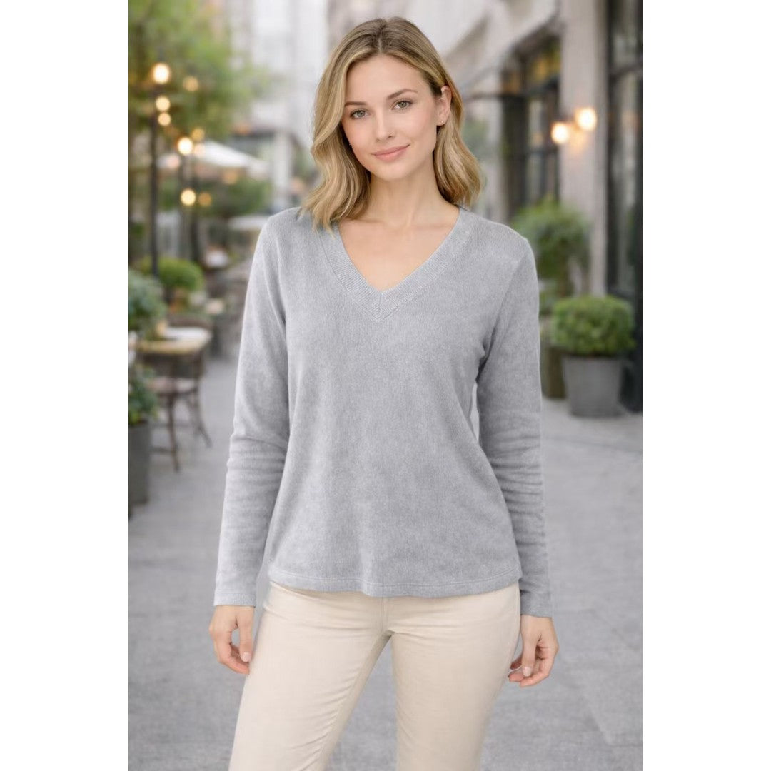 Woman wearing the Norah women's v-neck knit vintage sweater, flatlay view