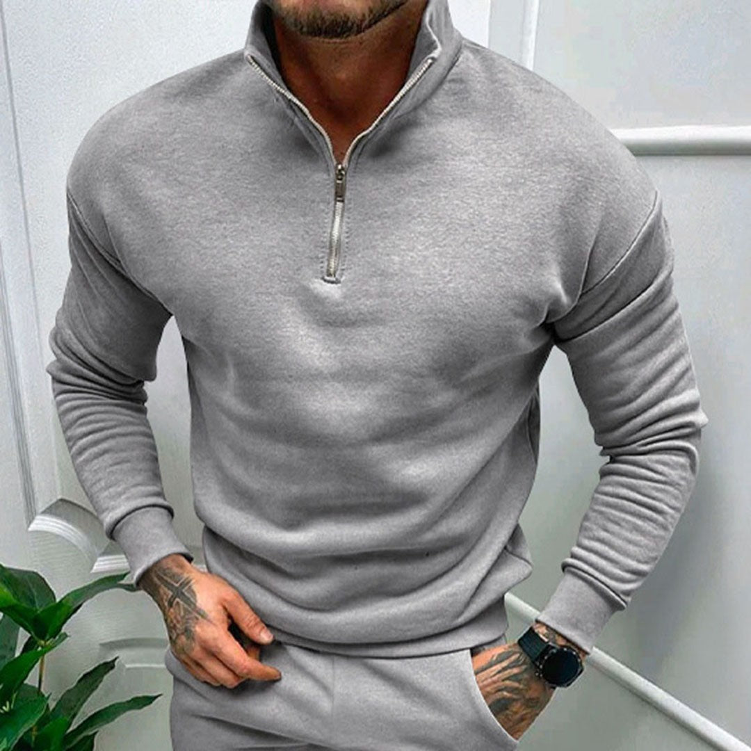 Man wearing the Octavian men's zip-up sweater, side view