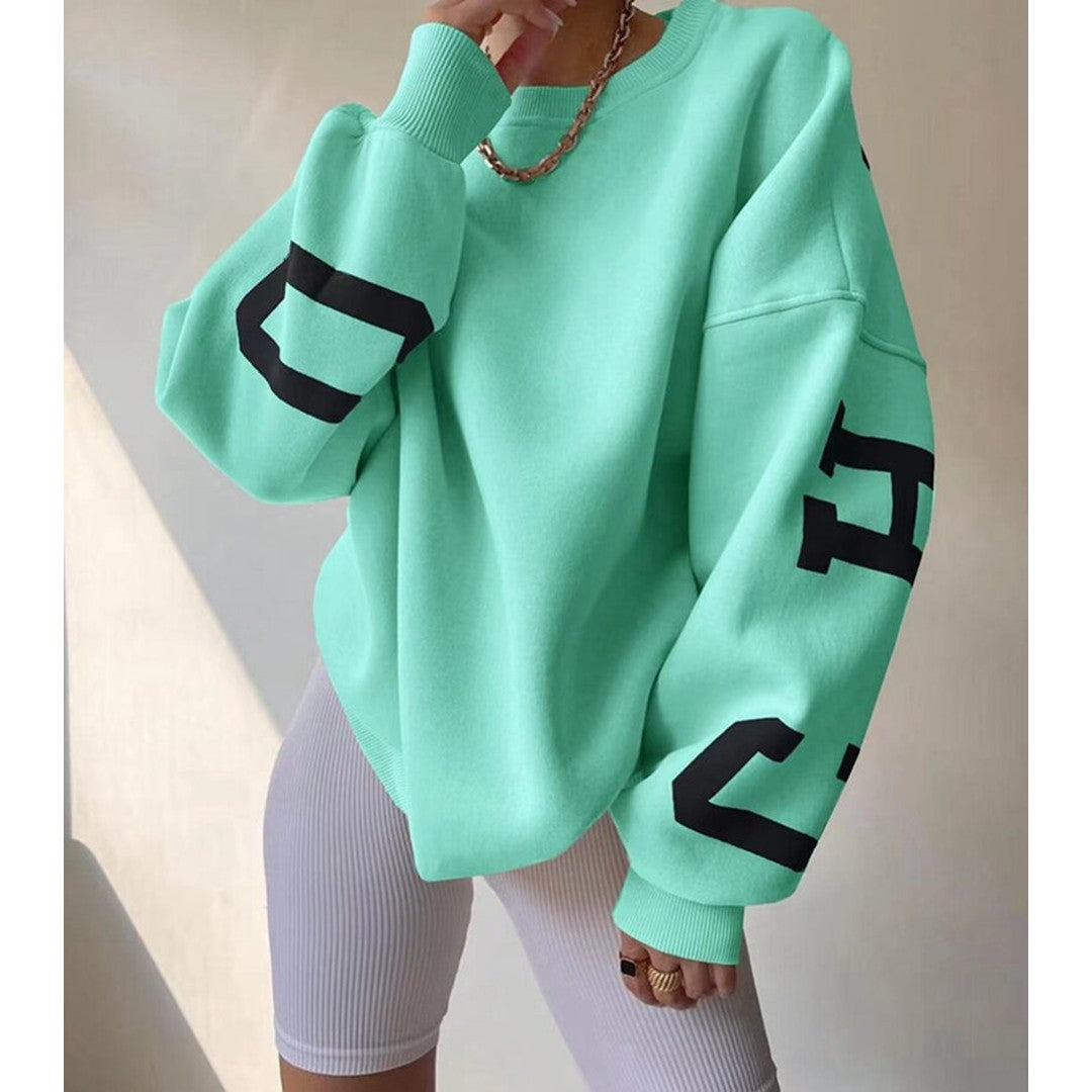 Woman wearing the Priya women's hooded sweater in beige, model view