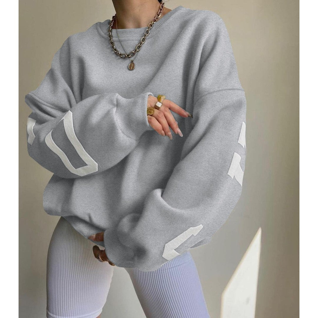 Woman wearing the Priya women's hooded sweater in beige, side view