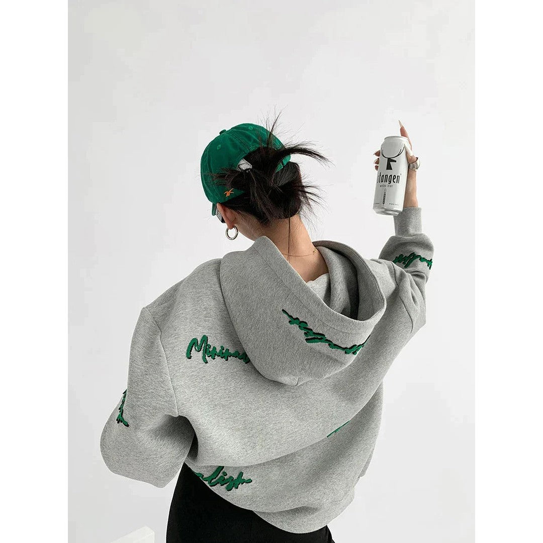 Woman wearing the Romilly women's hoodie, side view