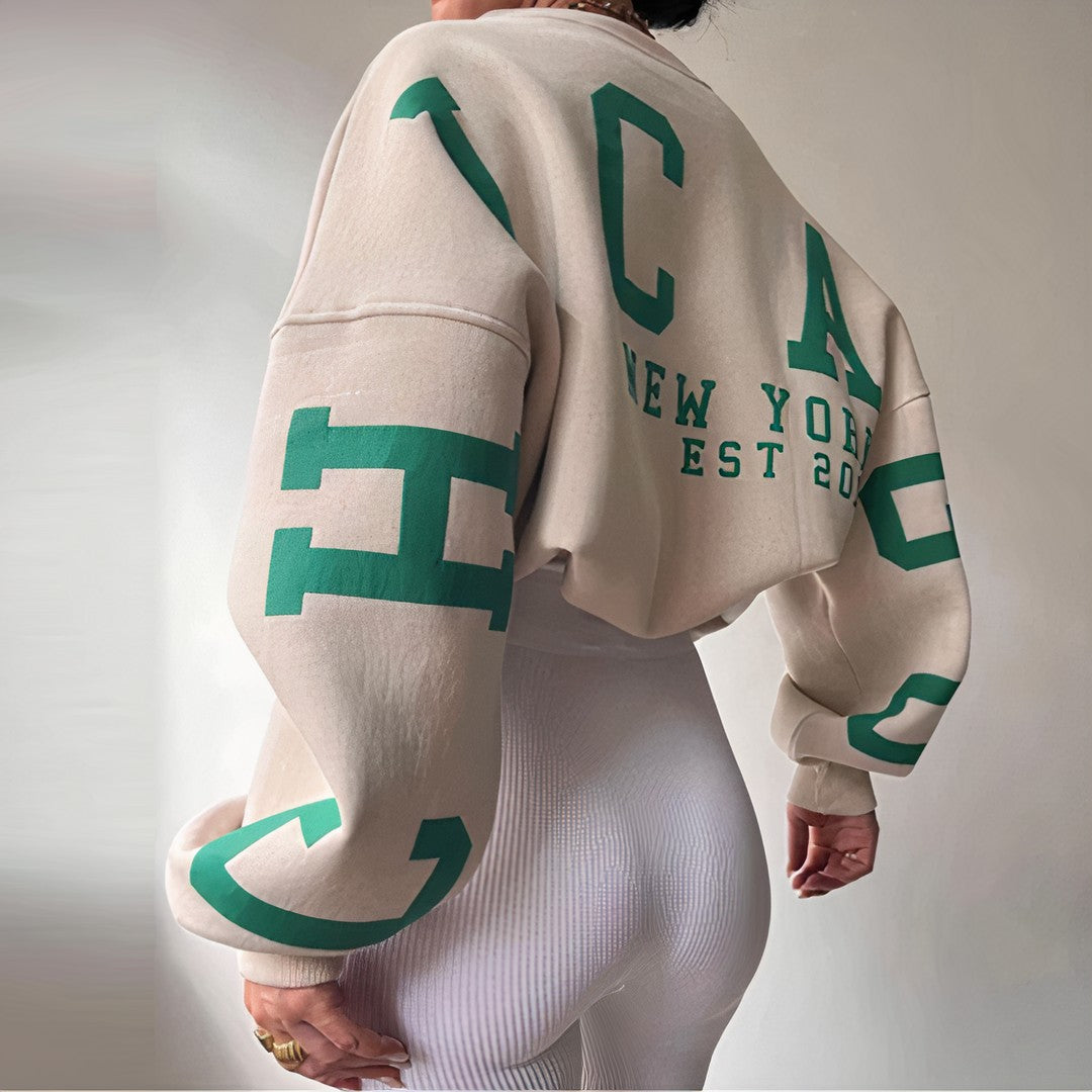 Woman wearing the Roxana women's crewneck long-sleeve sweatshirt, back view