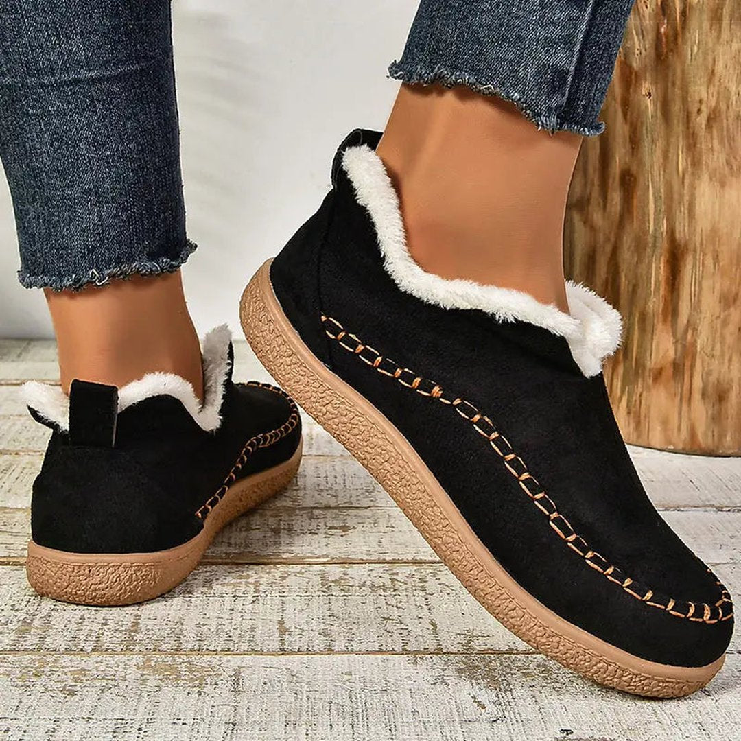 Woman wearing the Rylee women's boots, flatlay view