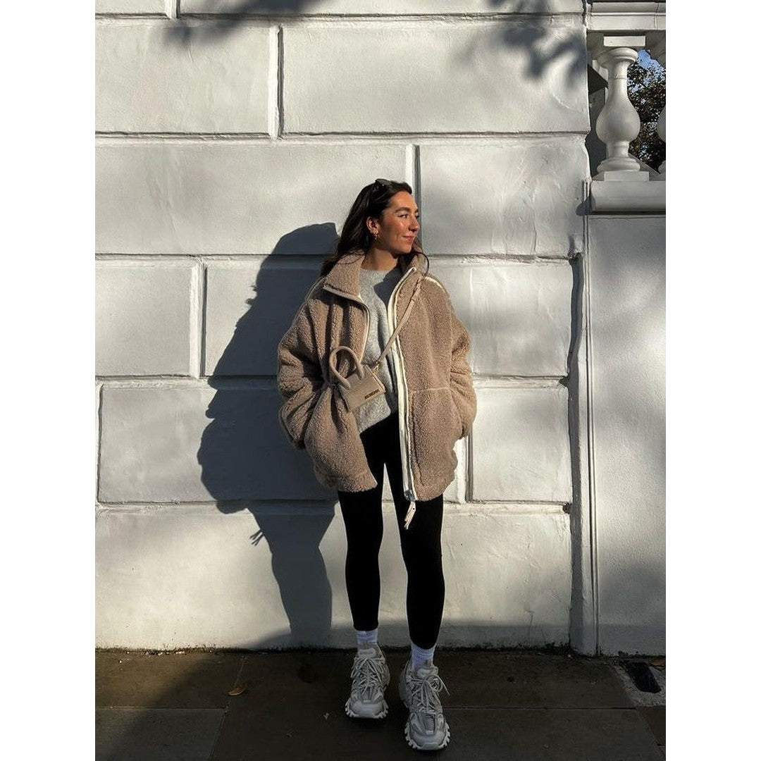 Woman wearing the Sadie women's oversized zip-up jacket, side view