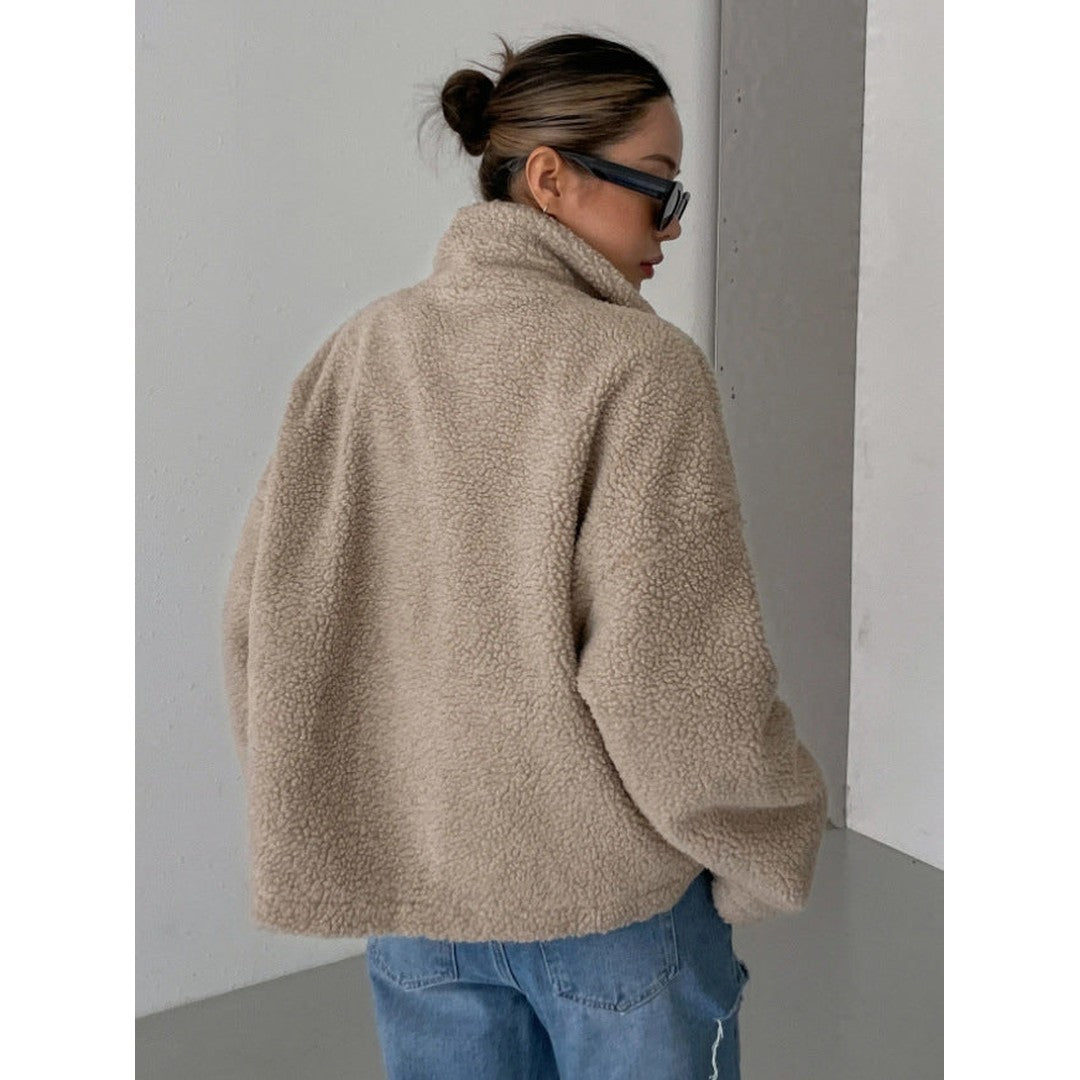 Woman wearing the Sanne women's wool jacket, flatlay view