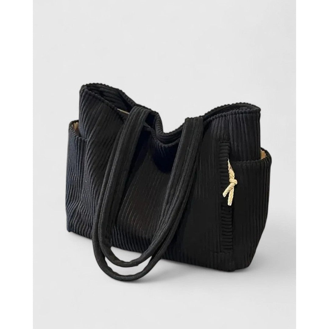 Woman wearing the Sarah women's bag, back view